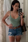 I absolutely love this bodysuit. The first one I received was an XS and it was wayyyyy too tight, the color was off and the material had no give so I sized up. I went up to a medium and the material was totally different. It was a lot softer and stretchier and the color was a nice off white more than a white. It did shrink so I'm sure my medium now fits like a small. I love this piece so much that I bought it in three colors. I bought the sage, white (off white), and the nude/tan color. Love them all. I'm debating getting the black as well Even though I have bodysuits in black already. I really love this piece after finding the right size, color, and material. - Christina H.