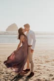 I ordered this dress last minute for my engagement photos and I am SO glad I did! I got an XS, which was a little tight around the waist for me (I felt like I couldn't take a very deep breath), but I didn't have time to exchange it and I was afraid a S might be too big anyways. I love the material. The chiffon or whatever overlay is on the bottom is actually pretty wrinkle-resistant and looked beautiful in the windy conditions that we had our photoshoot in. I wore one of those backless, deep plunge bras with the dress, which worked well but the part of the dress covering my chest did keep blowing/sliding and exposing my bra, which was a little frustrating. Maybe next time I'll try tape/pasties instead. Overall though the dress is absolutely beautiful and good quality! Would definitely recommend. Utilize their free return shipping within 10 days if you need a different size! - Becki G.