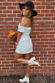 When I bought this dress it looked cute online. WhenIi tried it on I fell in LOVE. It's so flattering and a great material that doesn't wrinkle (I tend to live out of a suitcase and roll my clothes up). It's an adorable dress that can be dressed up or down. Stays up perfectly as it's technically a strapless. This is your sign to buy it! - Kaylyn R.
