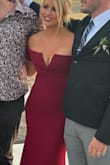 This dress has lots of stretch.  There's lots of room for "forgiveness" And It photographs beautifully... I was a little concerned because I have large arms and the drop sleeve l still fit them perfectly.  I highly recommend this dress! - Marianne H.
