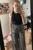 So I sized down based on some reviews and I'm glad I did because it fits perfectly (besides the length). I'm usually a small but I got an xs. I'm 5'2 and weigh 120. They are very long on me which I expected so I will have to get the tailored but I already knew I would have to so I really don't mind it. They are super comfy too. - Rachelle L.