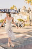 Love! Wore this dress for our engagement photos and it was perfect. It did fit a little loose, so I would size down if you want a more form-fitting dress. Other than that, it was perfect and photographed really well. - Elisa H.