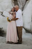 I was hesitant ordering my wedding dress online but due to Covid I didn't have many options. I looked online for a while for a more flowy look and found this dress. It's well made and surprisingly heavy, which I appreciated because none of it was see through.
It fit well and flowed nicely when I walked.
The color is true to picture.
The length is good, I would have loved a little longer but to be fair I'm 5'9 and was in 3" heels.
Definitely recommend. - Mandy M.