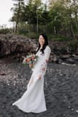 This dress was the BEST find for my last minute elopement due to having to postpone my actual wedding in June 2020. The dress quality is great (not completely sheer but would recommend wearing nude undergarments), embroidery is beautiful and I didn't have to make any alterations to it - I'm average height. I had to use some fabric tape to keep the top in place since I have a smaller bust, but other than that, this dress was perfect! Being a wrap dress allows for flexible sizing. I got so many compliments on how unique and beautiful the dress is. Love, love, love! - Donna W.