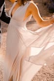 I wore this dress for my engagement photos and it looked amazing! great and flowy for pictures and very comfortable. The light grey color has a blueish tint to it. The bust was loose, so if you are of a smaller bust this is an area that will need alterations.
I highly recommend this dress looks amazing in photos! - Gisel E.