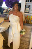 This dress is gorgeous in person. The material is good quality, nice and thick. So don't worry too much about the white being sheer. Although I did still wear nude Spanx and white bra. I have a smaller chest but bigger in the hips, butt and thighs and this dress shows off these curves perfectly. The button details on the back adds a lot of elegance. The asymmetry in the front is a cool design that really makes this dress and you stand out. I got so many compliments at my bridal shower and on photos after posting to social media. Buy this dress. You will not be disappointed. - Lena T.