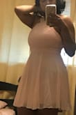 It fits perfectly around my waist but it was difficult squeezing around my ribs and breasts. It would've been perfect if the band around the waist was elastic. So if you've got a large bust, definitely think of sizing up or learn a way to maneuver the dress over like I did. - Jasmyne M.