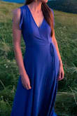 I kept this dress because it was the most flattering but it smelled terrible so I hand washed it but it didn't help the smell. While it was drying i noticed it already had a hole in the skirt side seam and the inner strung ties had come apart/unraveled. The snap closure is right on the edge of the neckline so it is visible at all times. The worst part was the massive gap under the snap closure that had appeared after washing the dress. It didn't want to stay closed. Fit wise, it is very long. I'm 5'10" and the bottom of the skirt just hit the floor on me barefoot which was a nice surprise for me, but would be too long on anyone shorter without heels. - Michelle M.
