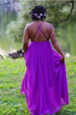 Flowy! The purple is vibrant in person. Beware that it's heavy. And long, if you're on the shorter size. Overall, gorgeous! - Lisah S.