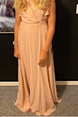 I got this for my daughter who's a junior bridesmaid. Runs a little long but by the time the wedding is it should fit perfectly. - Rebecca F.