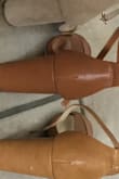 Depends on the shoe. Some fit differently. Listened to reviews that said ran large, so I ordered 5.5. Mistake. Bought a few more in my real size 6. The mocha size 6 feels a tiny bit bigger than the size 6 natural. Here they are: Natural, Mocha, & Camel. Beautiful colors though - Jacquelyn B.