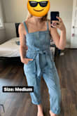 I ended up trying both the M and the S. I'm a solid Lulus M in basically everything, and I've read Free People can run small. Based on the size chart (and I chatted an agent about it too for the first time, cool tool!) I ordered a M. The waist was a hair big, but doable, but the top was way too baggy.

I debated a bit, and ended up exchanging for a S. If you search this piece on google, there's a cute outfit with a white sweater underneath and booties, that's what I was hoping to replicate.

So the S: it's difficult to get over my booty, but fits to a T everywhere once on. But, it's now so fitting that I can't layer a sweater underneath.

I've decided to keep the S and I'll mix up the look with a cardigan over the top instead. I prefer the fitted bust. - Ellen P.