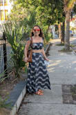 This was actually my first time wearing a crop top, was comfy with a strapless bra. I washed and dried this set before I wore it and it did shrink very slightly in the dryer, but it worked out because the skirt was initially a little long. Very light material, the skirt and top are both stretchy. I got so many compliments on this outfit; it was perfect for the beach. - Jacqueline P.