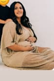 I purchased this after hating every maternity dress I laid eyes on. It worked wonderfully for our maternity photos with a nude slip. 34 weeks pregnant and about 215lbs. It is long but worked well for the vibe of our photos. - Anaiz