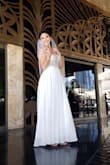We decided to elope with close friends and family to the place where my now husband asked me to be his gf, where we took our first roadtrip and where he said i love you for the first time (LAS VEGAS)! This dress screamed Vegas when i saw it and when i received it and tried it on for the first time I didnt want to take it off. It ran true to size, the only thing i did was hem the bottom a bit because it does run a bit long. I got MANY compliments the whole night and they were shocked when they found out how much it cost me. Its greaty quality and i wouldnt have wanted to get married in any other dress! - Yadira A.
