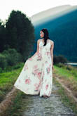 Like many others, I wore this for my engagement shoot. It's flowy, easy to wear, and looks great! I love how there's a thick satin-like layer underneath the print so any undergarment lines or colours won't show through. This dress is very long though, and for smaller busts, fashion tape might be good idea. Overall, love the material and style. - Pei E.