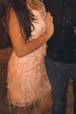 Fits great, great material, so many compliments. I initially thought it would be beads hanging off but it was the same material as the dress and never once uncomfortable. I also thought it would be tighter at the bottom and hug my backside more but it was loose. Not a deal breaker but in case anyone is expecting that as well. I'm 5'2" 135lbs and ordered a medium. - Vania R.