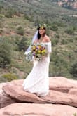 This dress is beautiful! A bit tight in the arms and stomach, but looks worth much more than the cost! - Christal T.