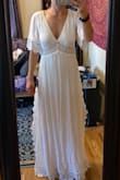 I got this dress to change into late night after my wedding. It's so flowy and beautiful. I'm 5'2" and the x-small fits perfectly with 3 inch heels on. It would be a little too long without them though. The detailing on the sides is gorgeous. My only concern is if you want to wear a bra under it you'd have to find one that doesn't show up through the lace. - Samantha H.