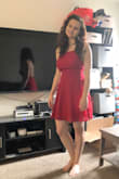 This cute little number got my man going sooo good. He loves the way the dress accentuates my breasts, the open back and the flirty little skirt. - Lillie-Ann B.