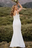 This dress was absolutely perfect for my mountain elopement. It's so flattering. The fit was very good, but I said "a little small" because it really does hug your curves -- leaves nothing to the imagination through your stomach and hips. I had to have the length adjusted for me (which cost more than the dress did!), but the fabric is so simple that the tailor was able to do it very quickly. I also had the adjustable straps changed to non-adjustable. The heavier weight of the fabric makes the dress feel more expensive than it is, and it resists wrinkles well -- just needed to steam it quickly that morning.
Shhh: I couldn't actually find underwear that didn't show at all, so for the ceremony and photos, I went without. You probably could wear a plunge bra with this, but the wires/ridges/seams in the bras I tried changed the look of the bust, so I decided to just wear sticky nipple covers. That was perfect for my small bust, but I'd recommend reading reviews of bigger busted folks if that's a concern. - Marguerite T.