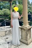 I wore this dress to my to my tiny pandemic wedding and it could not have been more perfect! It was very comfortable and flowy. The design was so dainty and elegant, perfect for a wedding on the more casual side. The price was a steal for a wedding dress. I chose to wear a sticky bra so it didn't show on the slits on the side. I did have to get the dress hemmed because it was very long on me, which is the only reason I didn't give 5 stars. - Melissa L.