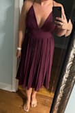 This dress is true to size and the quality of the dress is worth the price.  More of a formal wedding guest dress, - Samanth L.