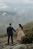 I bought this dress for my engagement photos and it couldn't have been more perfect! I received so many compliments on it. It did run very long so I had to get it hemmed a few inches. I also got the front and sides stitched together a tad so that I didn't have to worry about the front falling open at all as we were moving around, but it was a really easy fix. This dress was exactly what I envisioned for my flowy mountain photo shoot. So happy I chose this dress! - Katie E.