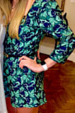 It fits perfectly! Wore a belt with it. It buttons up in the front so kinda annoying when you have to go to the bathroom, but otherwise super cute. - Hannah S.