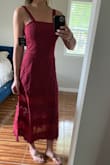 Love this dress. It fits in all the right places and has the tie to sinch in your waist. The pom poms and detail at the bottom are too precious! - Megan S.