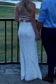 I loved this dress! I wore it for my casual outdoor wedding since my formal wedding was postponed due to COVID. This dress is light and airy with the thigh slit and the open back is so flattering. The lace makes it romantic without looking old. Loved it! - Kelsey D.