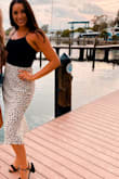 I love this skirt! I've worn it out to dinner with friends and dressed it with flat sandals. I've also dressed it up with a chunky heel and black top. Super cute and fits just right - Lexxis P.