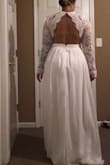I normally don't wear a medium. But looking at the size chart that's what would fit me best, and it did! The sleeves are slightly long but not too bad. I'm short and needed A LOT of length off. I do wish it had a little more cleavage, but it's mostly perfect and the back is beautiful. The price is a bonus, can't wait to wear it on my big day! - Rachel T.