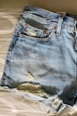 I've ordered a 28 Levis 501 from Amazon and they fit perfectly. However, these Levis 501 are slightly too large. I'm still deciding whether washing and drying will make enough of a difference for them to fit well.

But my main issue is that the shorts are more of a bright blue in the image advertised. The shorts I received are darker blue and have a dingy yellow tone to them. For example, the strings hanging off the shorts in the image are bright white and the strings hanging off the shorts I received are yellow. Also trying to decide whether a little bit of bleach would make enough of a difference to keep. - Kristen R.
