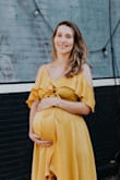 I wore this dress for my baby shower and it fit beautifully. Most longer bulkier dresses made me look like sack of potatoes and I felt beautiful wearing this one;) It covers all the right spots and yet is so light and flows. I also really look forward to wearing it after postpartum. - Elvira K.