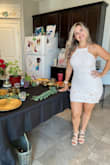 I ordered a M which is my normal size, I got a lot of compliments on it, but I had to keep pulling it down all night because it kept riding up. I have a larger chest and I felt like it was not flattering at all. Also, where the midsection is, I felt like it highlighted my problem areas. Super cute dress, but definitely order a size up if you're curvier. - Brianna W.