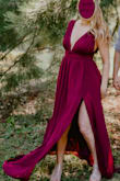 I looooove this dress. I wore it for engagement photos and the color and fabric look great in pictures. It's very flowy and moves well. The cleavage factor is high (including side boob), and you can't wear a regular bra, but the wide straps and V shape look fine without one. It runs pretty long -- I'm 5'8" and wearing 2.5 inch heels, it still dragged on the ground a little. - Heather S.