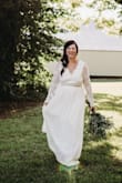 It fit almost perfectly! I had the sleeves taken in a little bit but the rest worked out great! I added a bridal sash to it and that was all that it needed for my wedding day. - Amber P.