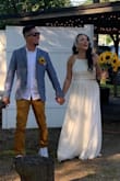 I was totally amazed and taken away by this dress I used it as my wedding dress. It was totally breathtaking all of my guest and my husband loved it. I loved how it was still sexy but still elegant. I got married by the water so the two pieces worked perfectly for my wedding I was totally in love with this dress the lace was prefect it wasn't overly done and the tie back was perfect when I 1st got it I was 30 pounds heavier and I was able to lose the weight and still fit in the dress perfectly. The bottom was tight and 1st so thank god j lost the weight but I had every intention on losing weight so that's why I went with the size I went with. The slit in the shirt was perfect not to high showed just enough leg when walking without being too risky. Would definitely Recommend this dressed to any bride on a budget. I even changed my skirt after my ceremony during the IDO BBQ to something more casual to not be dragging my wedding skirt around and it was perfect. The quality was amazing and the price was perfect. - Jesselyn R.