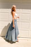 This skirt is awesome. I love that it's not a stretchy material. There is no stretchy band that gives you love handles. It nicely rests on my hips. - Lauren V.