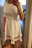 This dress is made of the classic Lulu's material that I love! It is a bit thicker and has a good amount of stretch in it. The dress is not see-through at all and is a very comfortable fit. I wore this for my wedding reception and paired with nude heels and it was perfect. - Nikki A.