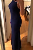 This is the classic Lulu's fabric that I love so much. It is thicker material that has a good amount of stretch and is very flattering. I did make a minor adjustment to the length of the straps in the back as they were too long, so I had them shortened slightly. I likely could have gone with a size small but didn't want it to be too tight around the waist. 
I wore this to a work gala event and received so many compliments throughout the evening. The dress is very long, which I like and I was able to wear heels with the hem still grazing the floor. - Nikki A.