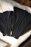 I wanted the XL which fits me perfect but you were sold out so I ordered the 1x and it is much shorter than the XL and overall snug. Surprised it would be so much smaller than XL. Thinking it might be an error in the tagging of the dresses.  I kept both of them because I can still wear with a skirt or leggings under but too short to wear without one.  Below is a pic of the XL next to the 1X to show the difference - Deborah D.