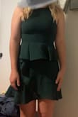 I bought this to wear to a friend's wedding and I love it! I ordered a medium, and after reading the reviews I was afraid I should have ordered a large but it fits well! It's a little more 'snug' than how mediums generally fit me, but overall I'm happy with it. The ruffles on the skirt are super flattering and it's a great length! - Lauren L.