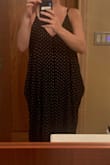 I saw this in some reviews but decided to take a chance because I loved the dress. The pockets stick out in a very odd way. It's also quite big. I'm 19 weeks pregnant and it was huge on me. Kind of what I wanted but at my size, probably not a good option for petite girls. I wish it had worked. I'll be returning. - Dorothy O.