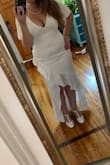 I bought this dress with no reviews and no pictures of a model wearing it! I figured it's cheap enough and I can return it if it's not cute lol but ITS AMAZING! It's going to be perfect for my wedding and fits me like a glove! I am a curvy girl 5'5" 170lbs and 38DD and I ordered a large. I do need to wear a Bra with it and some spanx (I am only wearing a bra in the photos) lol but I'm super happy with this dress. It's beyond anything I could have expected. It's satin material with a nice layer inside to which nicely hides all my tattoos so they don't show through the dress at all! Pics are from it straight out of the box so it still needs to be dry cleaned to remove the wrinkles. - Georgia D.