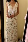 This is a BEAUTIFUL dress! I wore it for my bridal shower and it was perfect for the occasion! It was slightly loose in some places, but it was still a flattering fit. It does run a bit long though- with my heels I was probably 5"9', but I still had to lift it up a bit when walking. It's got that really feminine, chic feel to it, which I love. And I received so many compliments on it! Would recommend it 100%. - Anna K.