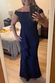 I loved this dress! It was perfect for the wedding. I ordered it, and it arrived a week later. Warning for short ladies, I had to hem like 8 inches off. It was super easy material to work with though. I also managed to get away with not wearing a bra due to the material being so supportive. A little toasty for a humid outdoor wedding. - Danielle S.