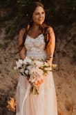 I bought this dress last minute when my wedding was postponed. We decided to still elope on our actual wedding day though, and I loved wearing this dress! The top was a little big, but it was an easy alteration to take in. Loved the color and the details of this dress. - Rebecca S.