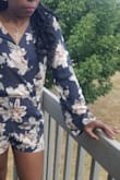 This fits true to size. Am about 140 lbs and I ordered a small. You can dress it up or down, just be mindful; the material is described as washed and yes it was, it had that faded look. I missed that part of the description, but decided to keep it because it was still cute. - Motolani O.
